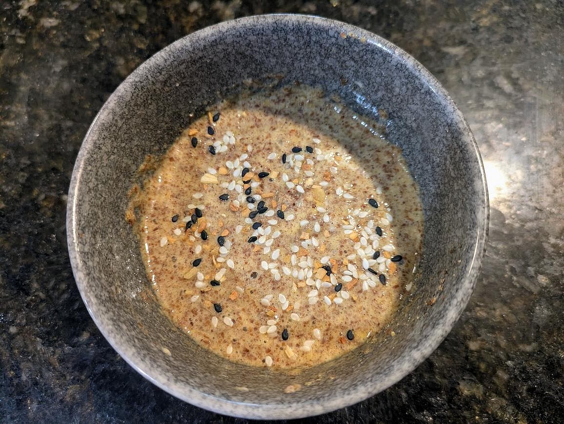 In a small, lightly oiled ramekin, add ground flax, baking powder, and an egg. Add in any desired seasonings, like garlic powder, onion powder, nutritional yeast, or everything bagel seasoning. Whisk together.