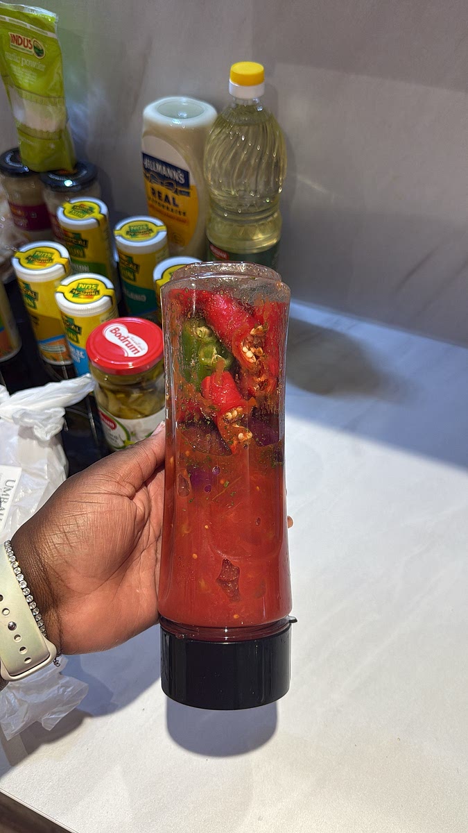 Add 1 can of chopped tomatoes and blend everything until you have a smooth-ish chilli sauce.