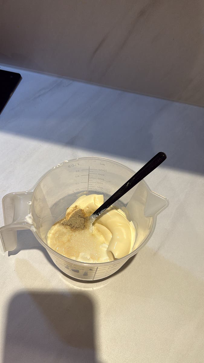 Mix together: Greek yoghurt + mayonnaise + garlic paste + garlic powder + white pepper + lemon juice + salt. Add a little water at a time until you get that pourable kebab-shop garlic sauce consistency.