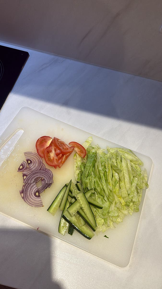 Slice up your:
lettuce, cucumber, tomatoes and red onion.