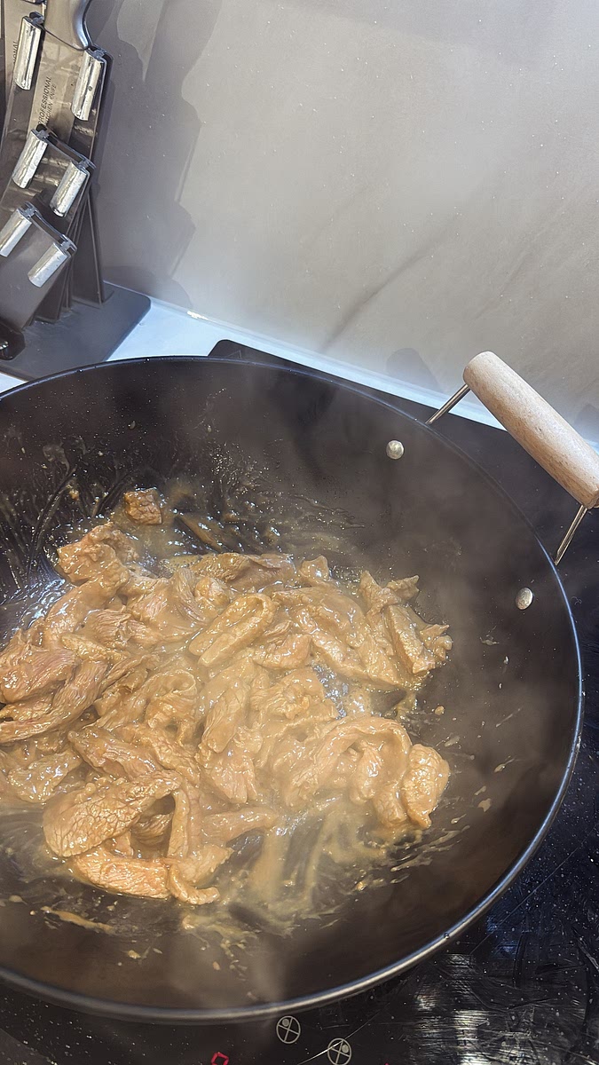 Heat oil in a wok or large frying pan over high heat. Once the pan is really hot, add the beef and stir-fry until browned. It doesn’t need to be completely finished at this stage because it’s going back into the wok. Remove and set aside.