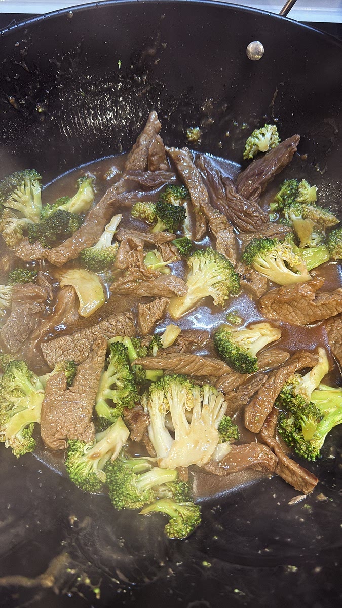 Give your sauce mixture another stir, then pour it into the wok. Toss everything together and cook until the sauce thickens and coats the beef and broccoli.
