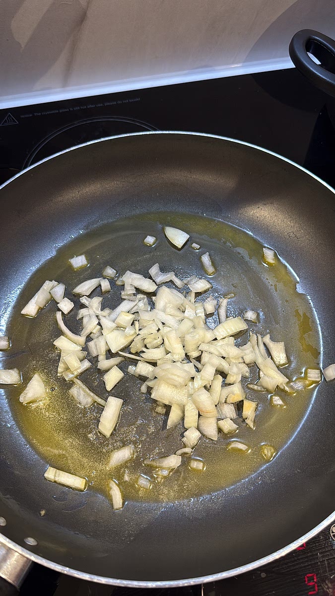 Melt some butter in a large pan. Add 1 diced onion and cook until softened.