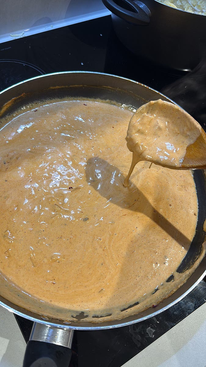 Pour in your double cream, then add your cheese of choice. Stir until everything melts together into a smooth, creamy sauce. Add a splash of the reserved pasta water to loosen the sauce and get that glossy consistency.