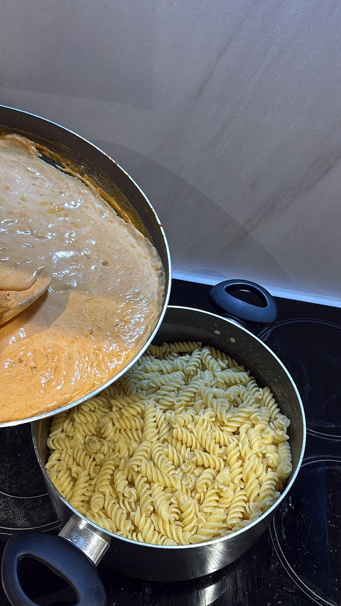Pour the creamy sauce over your cooked pasta and mix until every piece is coated.