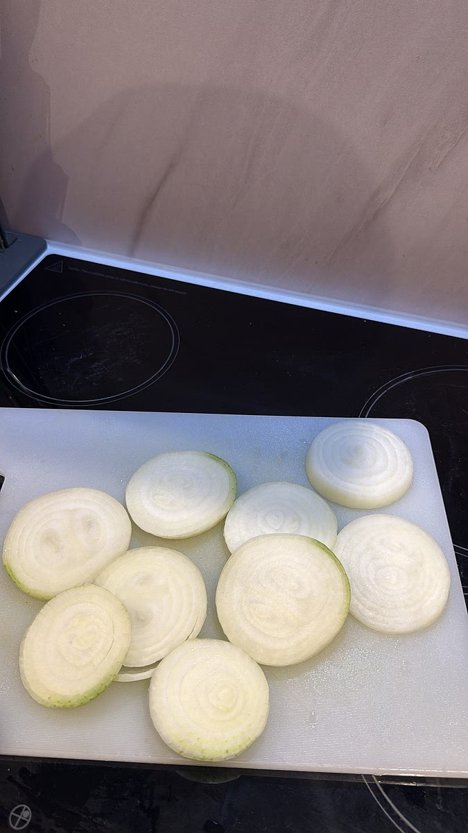 Cut several thick rounds from the large onions, keeping the rings together — these will replace the burger buns. Finely dice the remaining onion for the animal-style fries.
