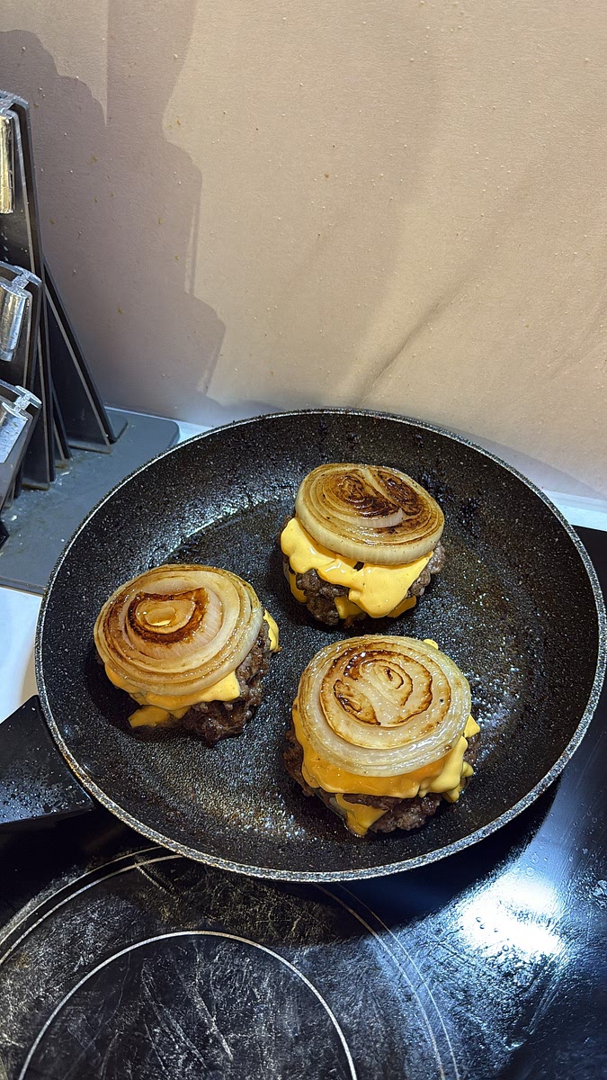 Cover the pan with a lid for a minute or two, allowing the residual heat and steam to melt all that cheese together.