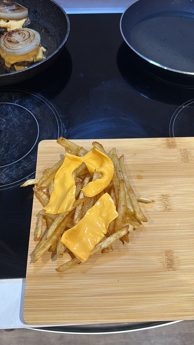 Pile the hot fries onto your serving plate, add the American cheese while they’re still piping hot so it begins to melt, drizzle generously with the homemade sauce and finish with the caramelised diced onions.