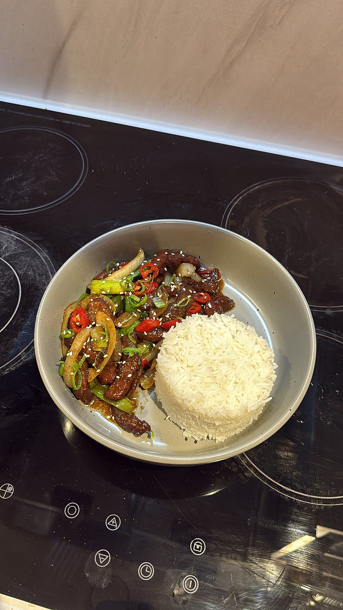 Serve immediately alongside fluffy basmati rice, making sure to spoon some of that sticky sauce and onions over the beef.