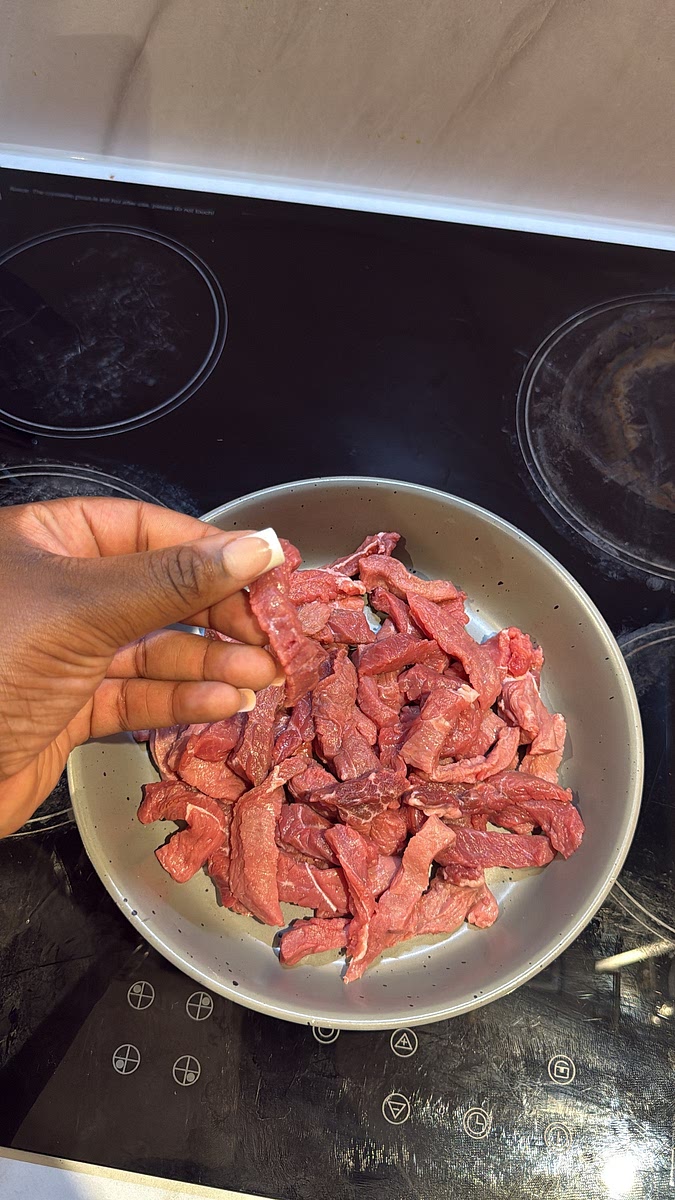 Thinly slice your beef into strips, preferably against the grain. Keeping the pieces thin helps the beef cook quickly and stay tender.