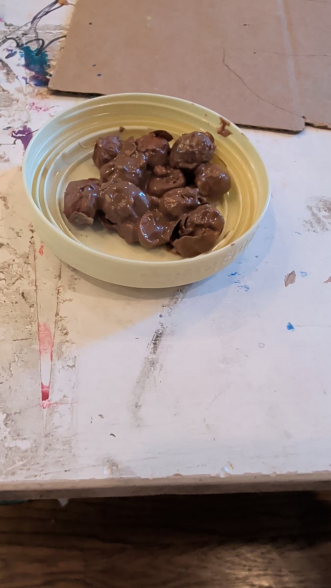 Prepare hazelnuts in a cup and pour the chocolate in the cup with the hazelnuts
