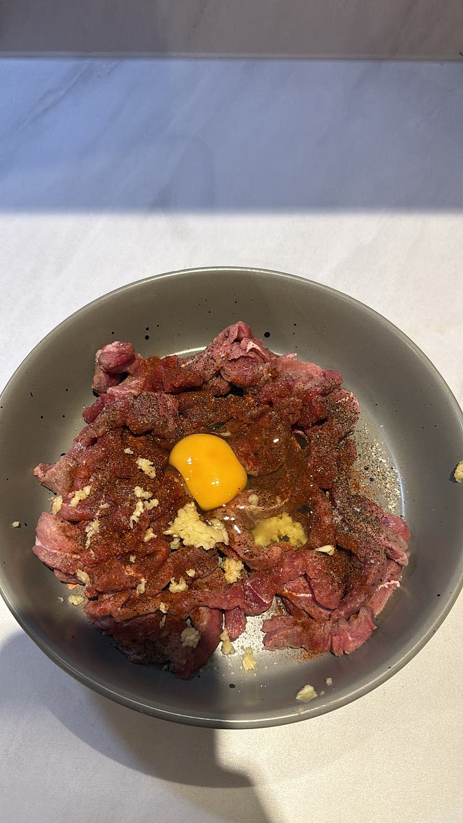 Season with salt, pepper, garlic granules and paprika.