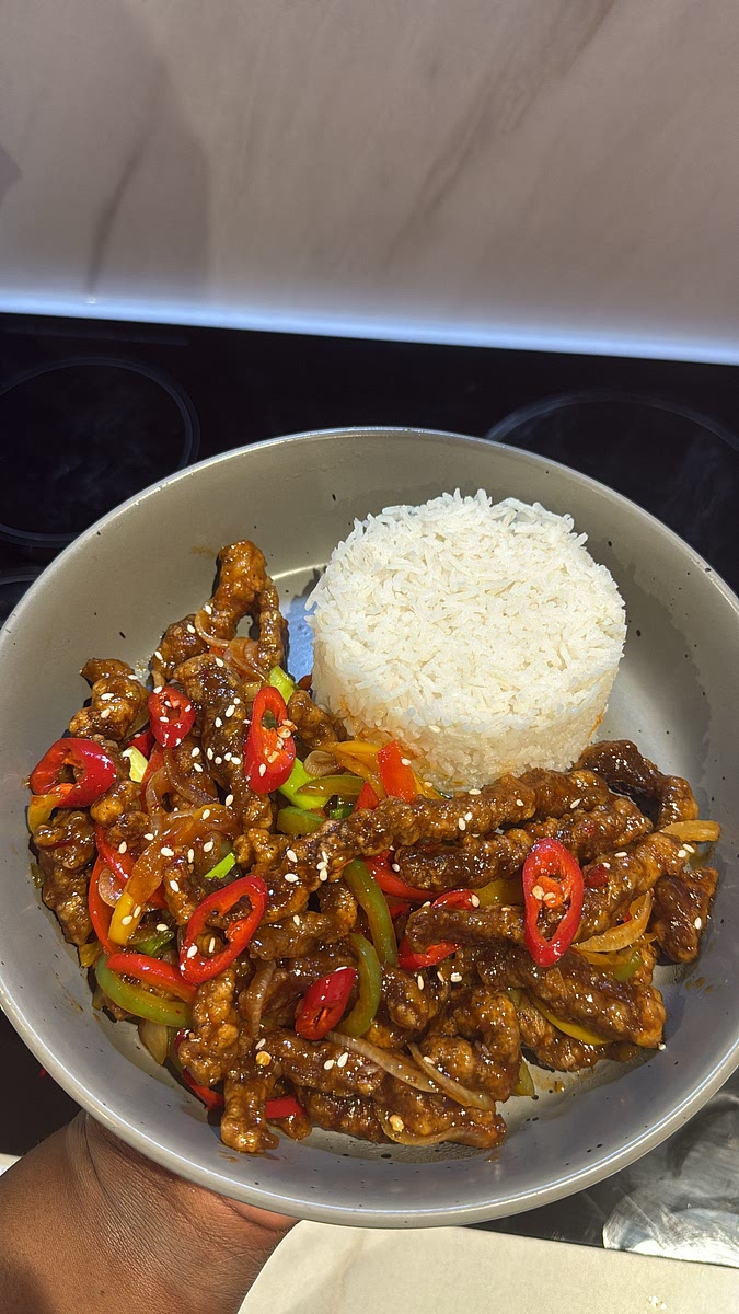 add the remaining spring onions and fresh chilli and top with sesame seeds if you like.