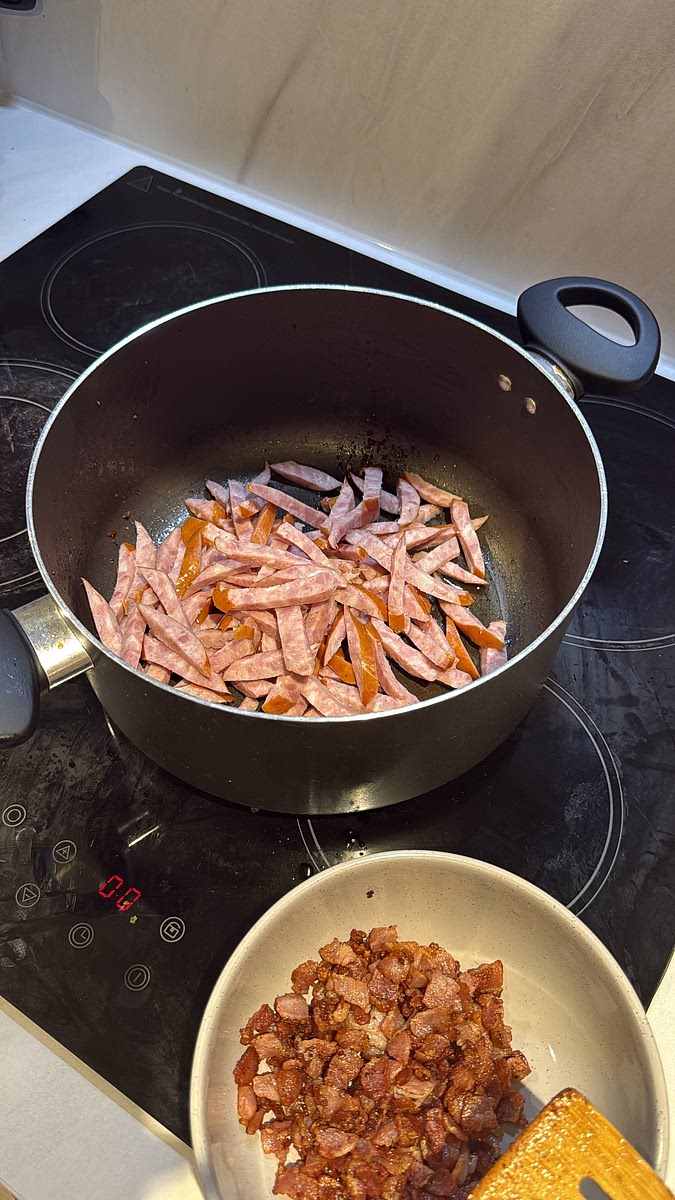 Fry the sliced sausage until browned and slightly crisp around the edges.