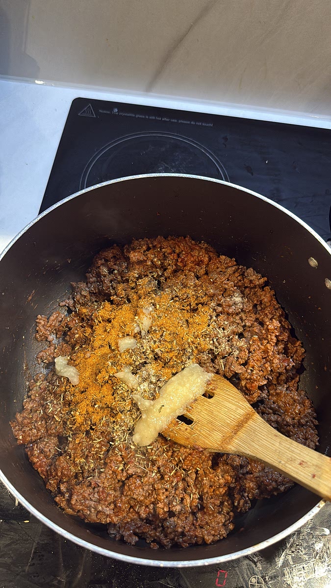 Add salt, Old Bay, Italian seasoning, Cajun seasoning, smoked paprika, garlic paste, Aromat and white pepper. Mix everything thoroughly so the mince is evenly seasoned.