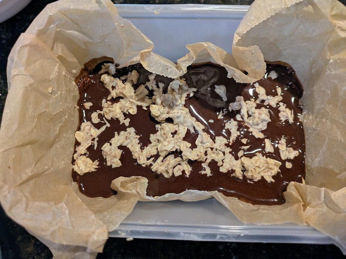 Crumble the rest of the oat mixture on top, lightly pressing it into the fudge. Refrigerate for at least 2 hours to set before slicing and serving.