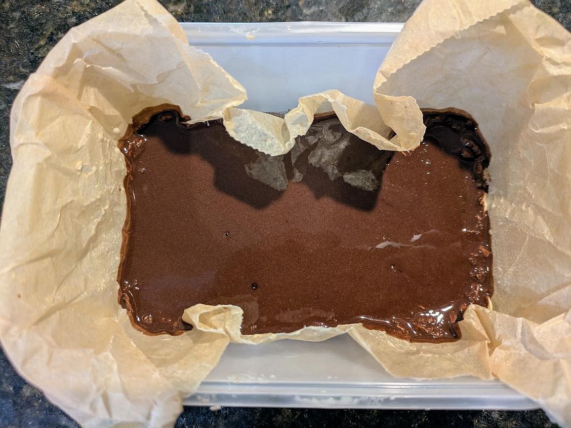 Pour the fudge over the oat layer, and spread evenly to all sides.