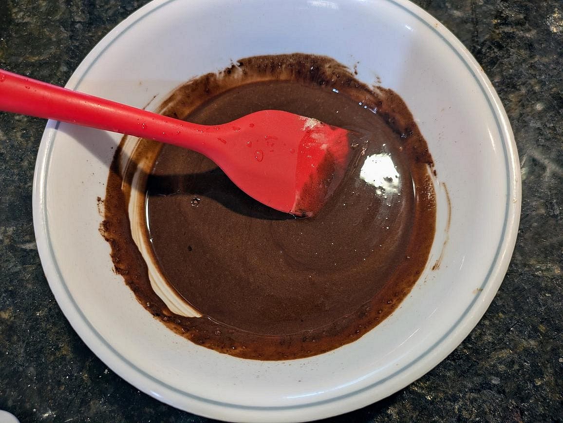 In another bowl, add the pea butter, melted coconut oil, cocoa powder, and pure granulated monk fruit. Mix with a spatula to make the fudge.
