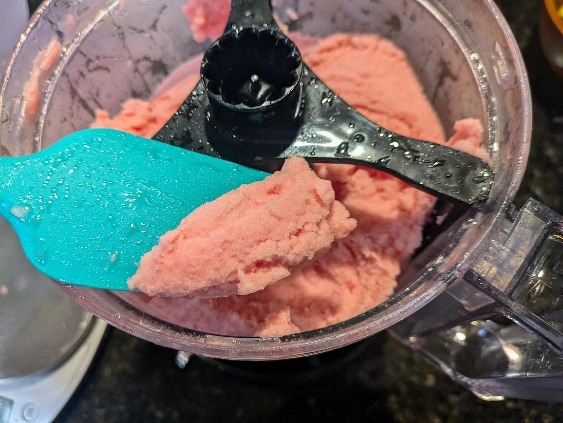 The following morning, add your frozen watermelon to a food processor with lime juice (or lemon juice) and salt. Blend until you have a smooth sorbet.