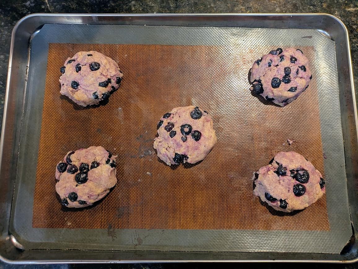 Divide the dough into 5 even pieces, about 100 g each. Shape into round, thick circles on your cookie sheet, about 3/4" tall.