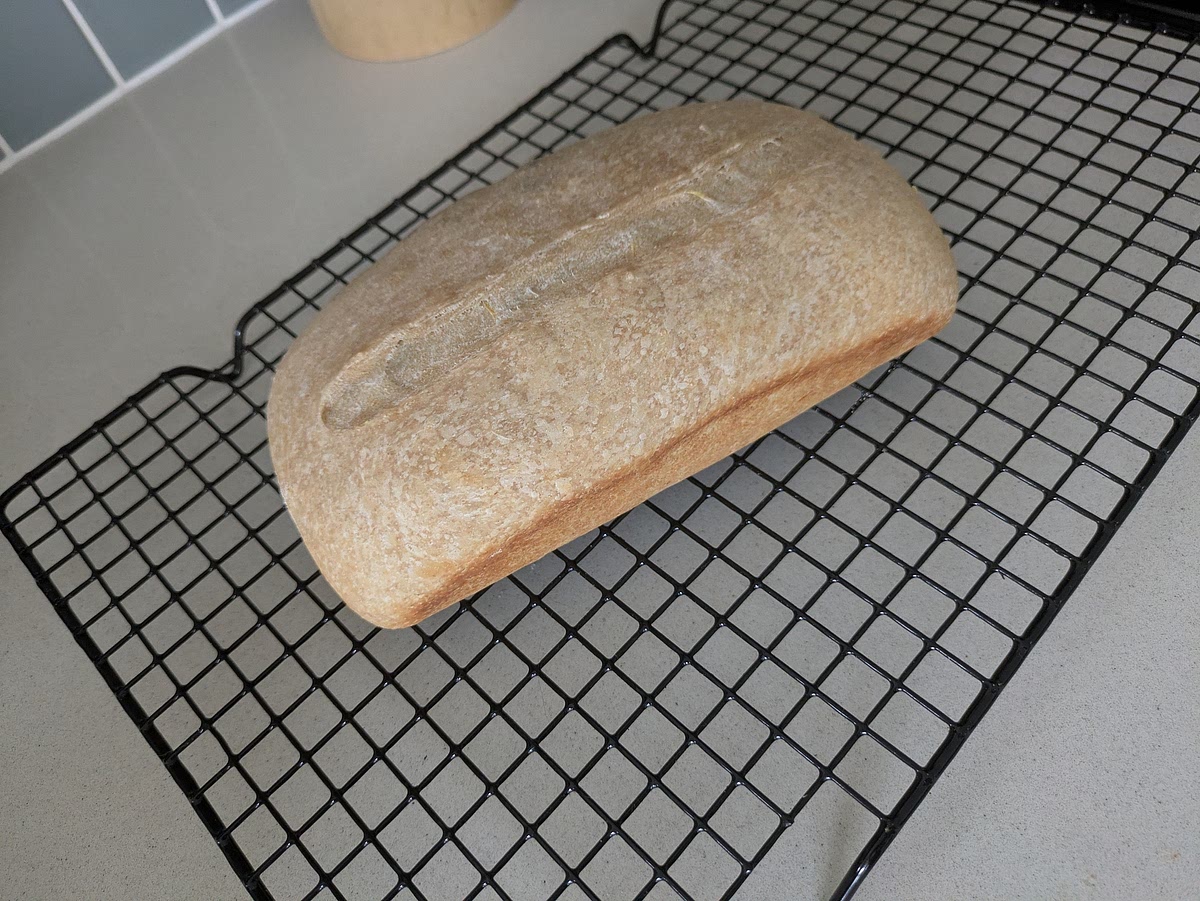 Cool Completely
Lift the loaf out using the parchment paper edges and rest on a wire cooling rack for at least 2 to 3 hours before slicing so the moist interior crumb sets cleanly.