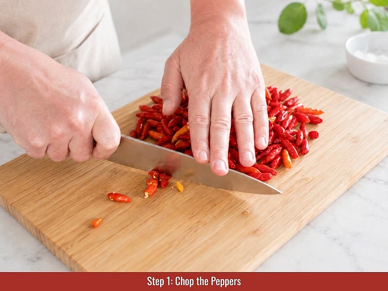 Prepare the Tabasco peppers: Choose ripe red Tabasco peppers without mold, soft spots, or damaged areas. Remove stems, rinse the peppers, and cut them in half if needed for inspection. Keep seeds for more heat or remove some inner tissue for a milder sauce.
