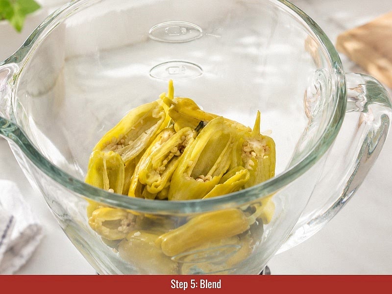 Blend the sauce: Strain the fermented pepperoncini, onion, and garlic while reserving the brine. Add the fermented vegetables into a blender with 1 tablespoon (15 ml) raw apple cider vinegar. Blend until smooth, then add reserved brine gradually until the preferred consistency is reached.