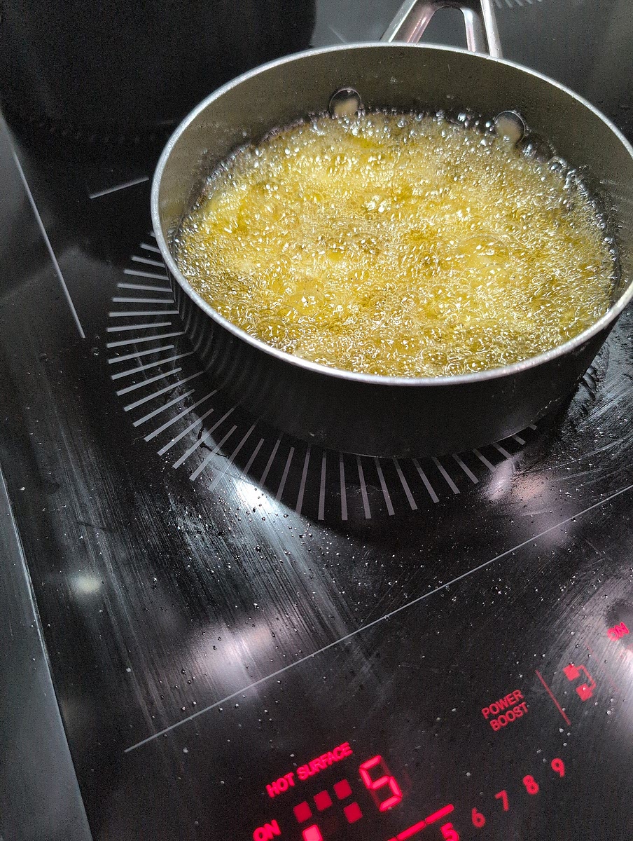Fry potatoes in vegetable oil and set aside.