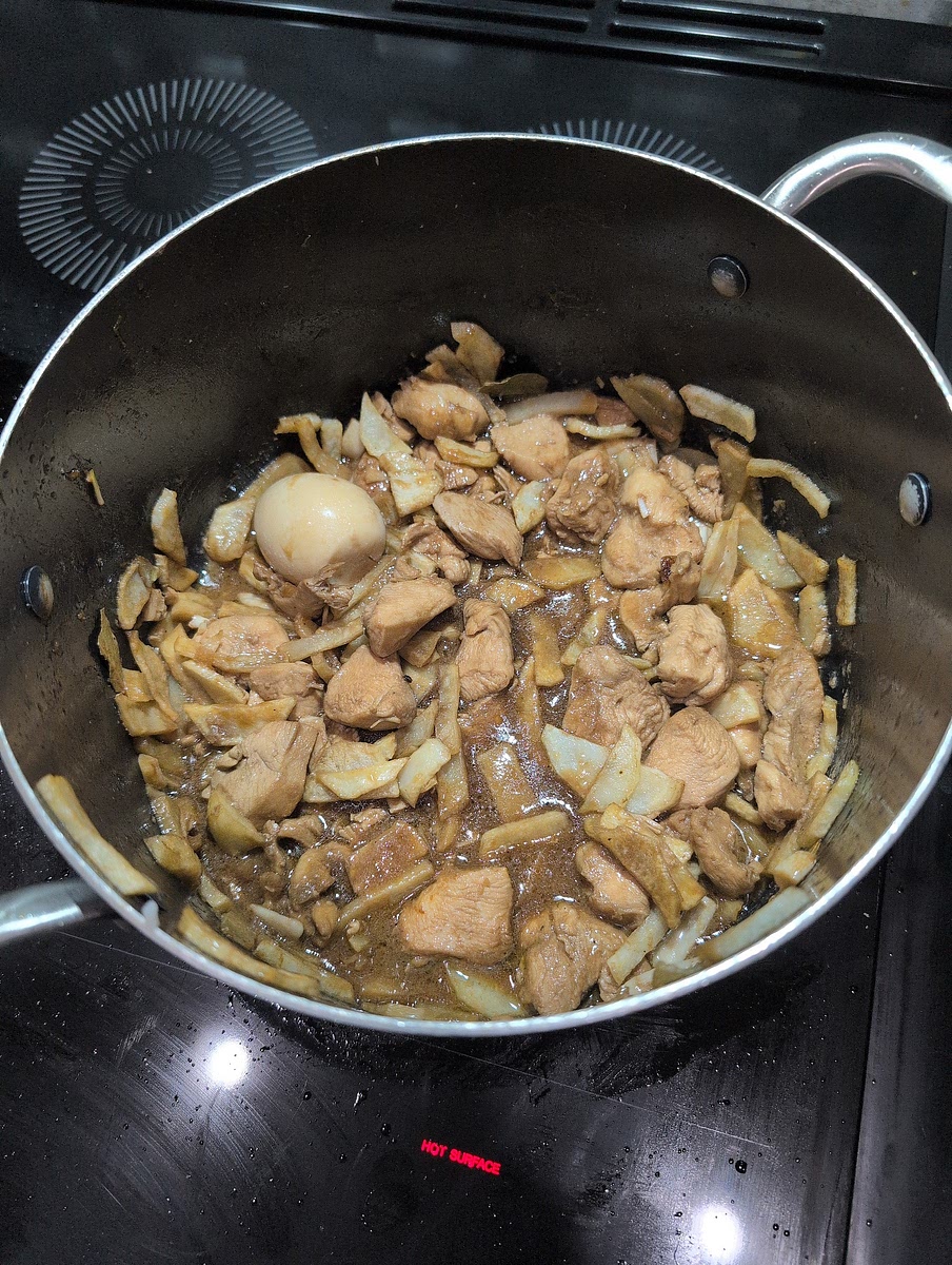 Add marinade sauce and bring to a boil. Add chicken, potatoes, and eggs. Stir and Cook for 5 min at med-low heat. Let stand for 5 minutes