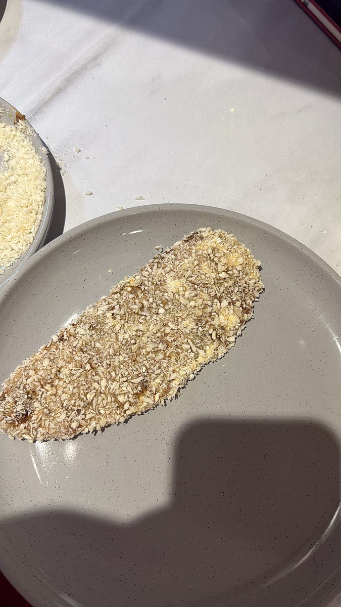 finally press firmly into the Parmesan-panko mixture.