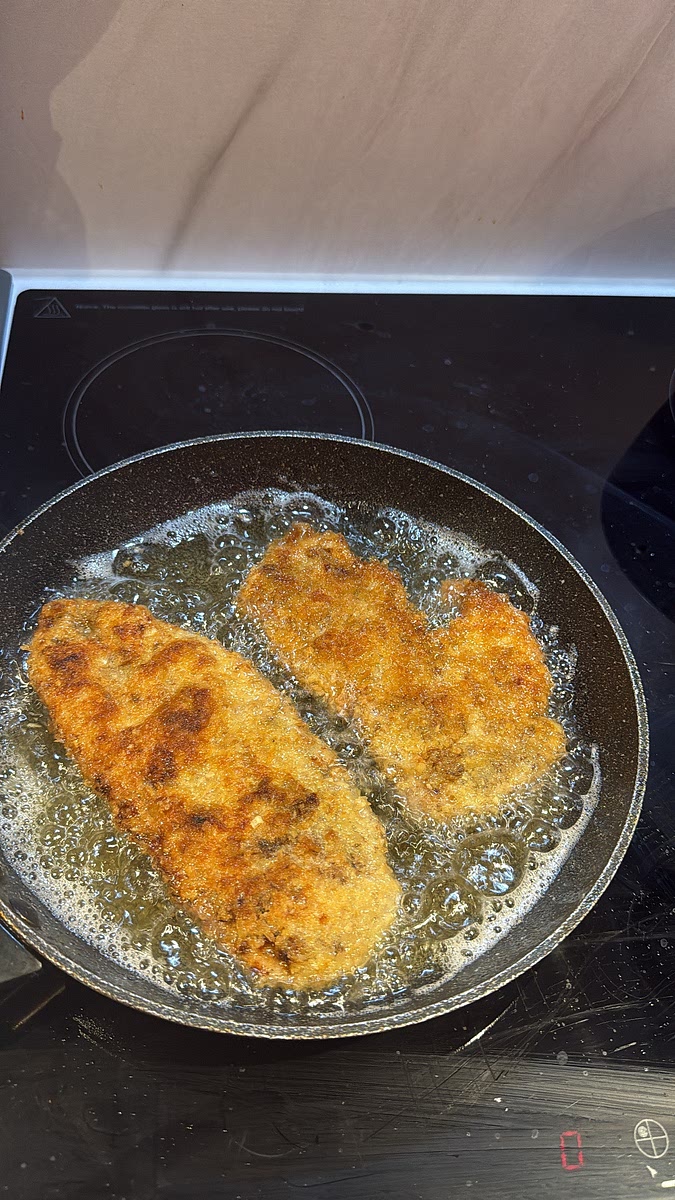 Add the chicken without overcrowding the pan and shallow-fry for approximately 3–4 minutes per side, depending on thickness, until deeply golden, crisp and cooked through.
