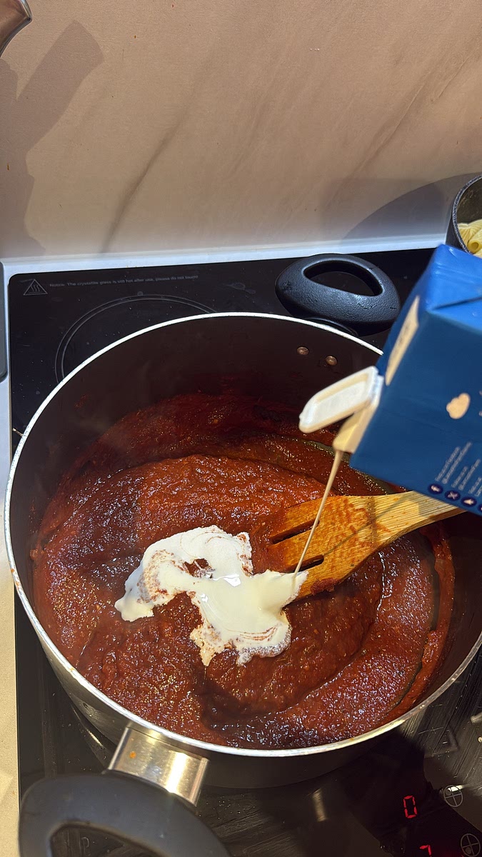 To your remaining sauce add 80ml double cream and stir until you have a rich orange-red creamy sauce.