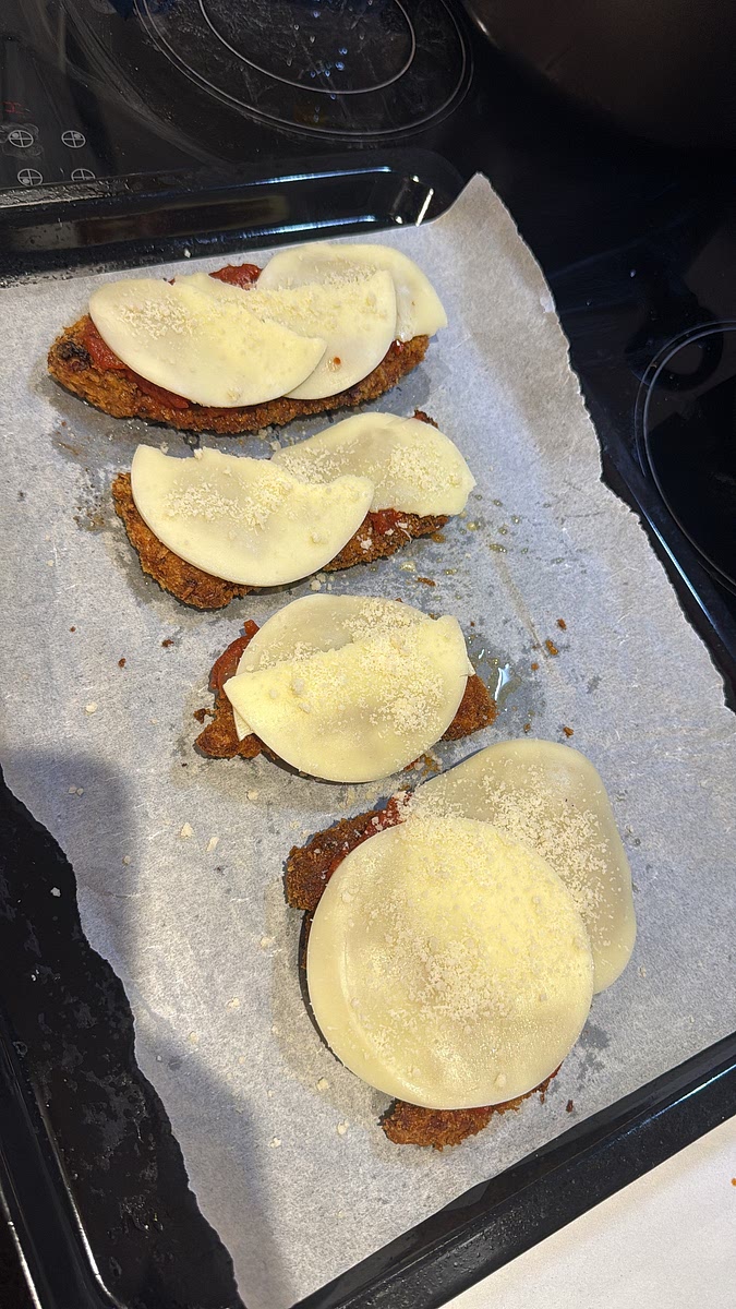Top generously with mozzarella followed by Parmesan. Place under the hot grill for approximately 2–4 minutes, watching closely, until the mozzarella is melted, bubbling and beginning to turn golden.