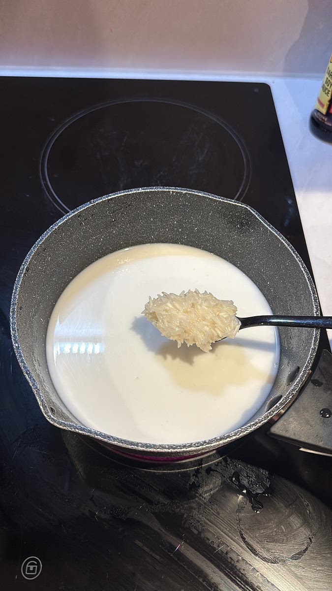 Add the rice, coconut milk, water and a pinch of salt to a saucepan. Bring to a gentle boil, then immediately reduce to the lowest heat and cover.