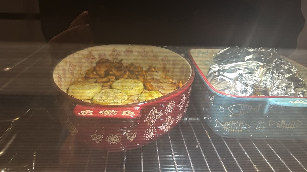 Bake trout with foil and parchment paper together, a topped lemon alongside with oiled zucchini and mushrooms at 200°C for 20 mins.