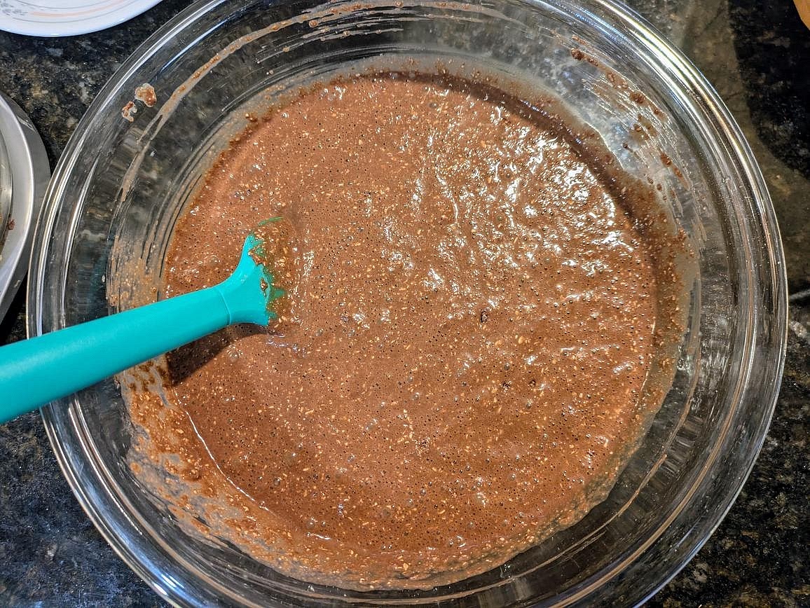Add the dry ingredients into the wet, and mix until just fully combined with a silicone spatula.