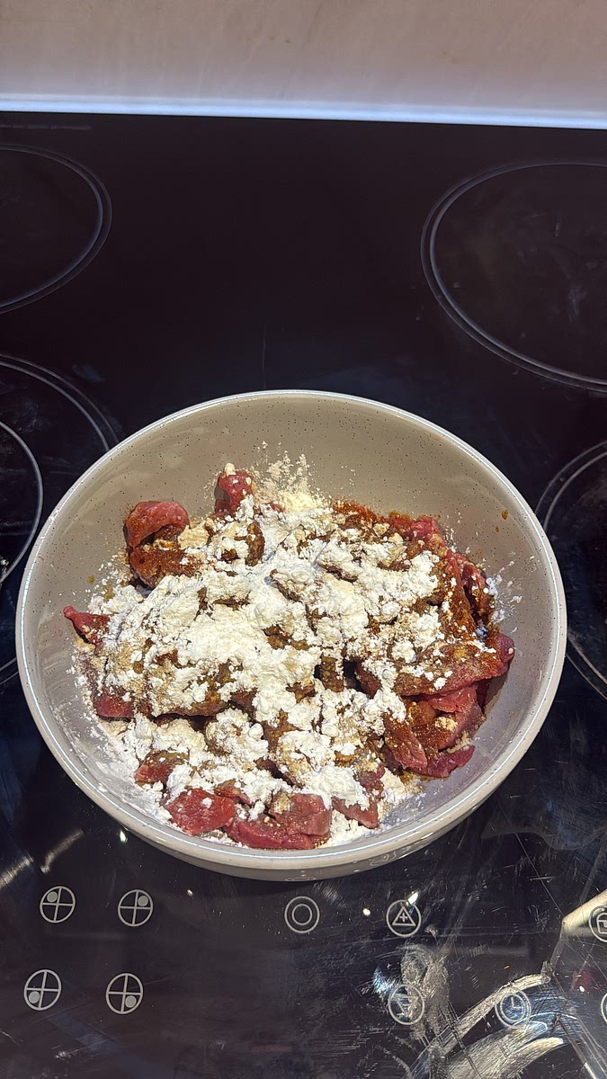 Add it to a bowl with garlic granules, smoked paprika, onion granules, pepper, a tiny pinch of salt, soy sauce, cornflour and oil.