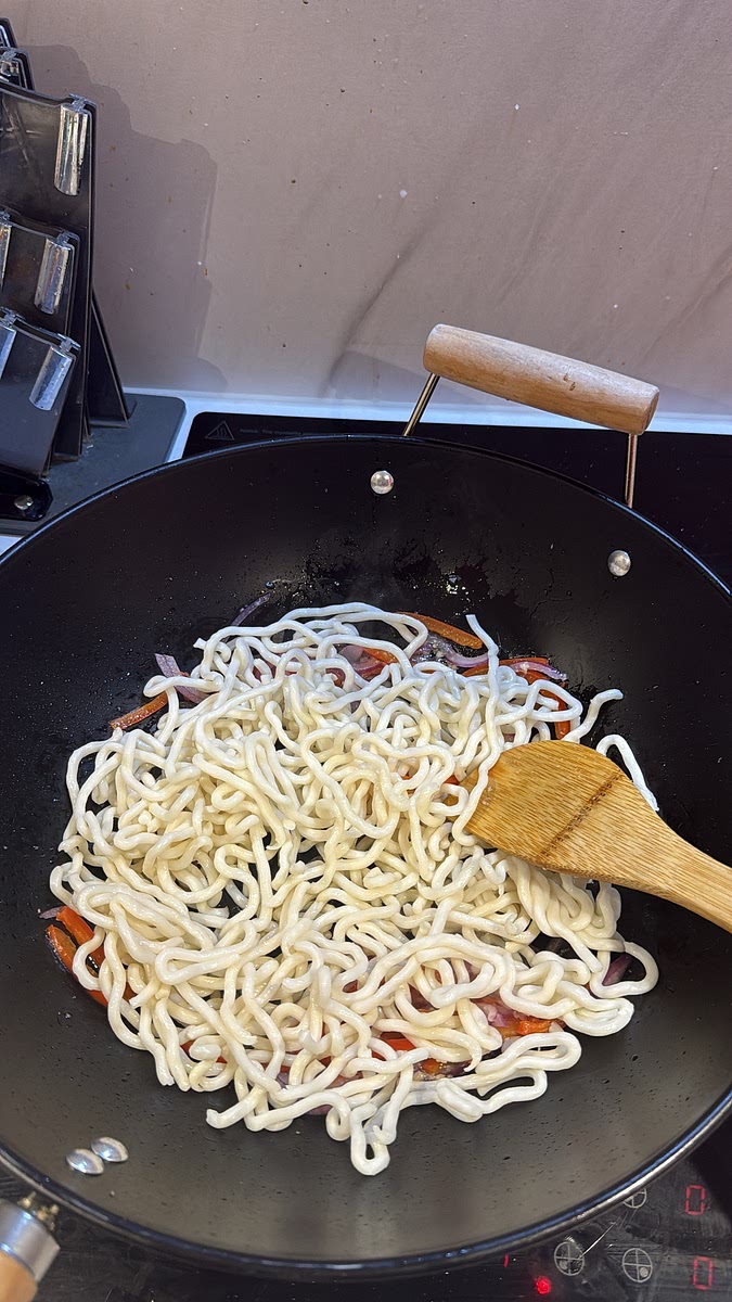 If your udon are vacuum-packed/pre-cooked, loosen them according to the packet instructions first. Add them straight into the pan with the vegetables. Toss over high heat for about 1 minute.