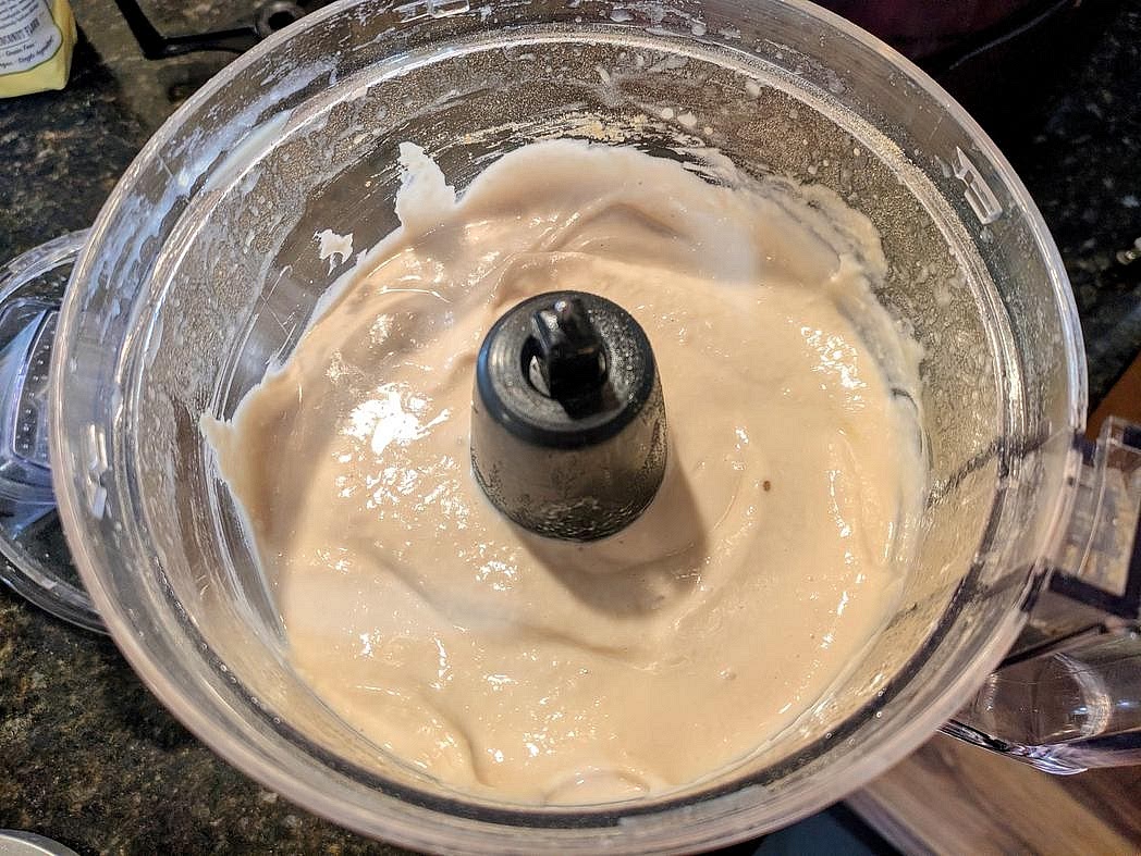 Drain and rinse your beans, reserving the liquid. Add to a food processor with lemon juice, vanilla extract, and monk fruit. Blend until smooth.