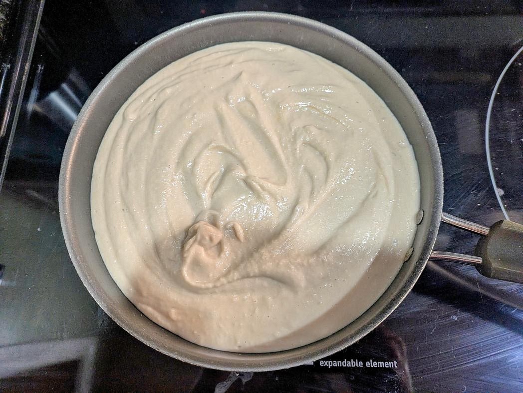 Transfer the blended beans to a medium pan over medium low heat.