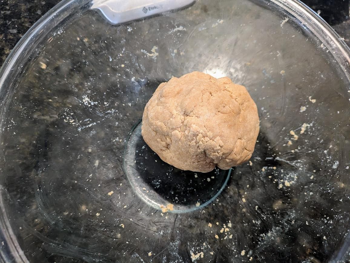 In a large bowl, mix together cashew butter and coconut flour. Add in just enough aquafaba to be able to combine everything together into a slightly dry dough.