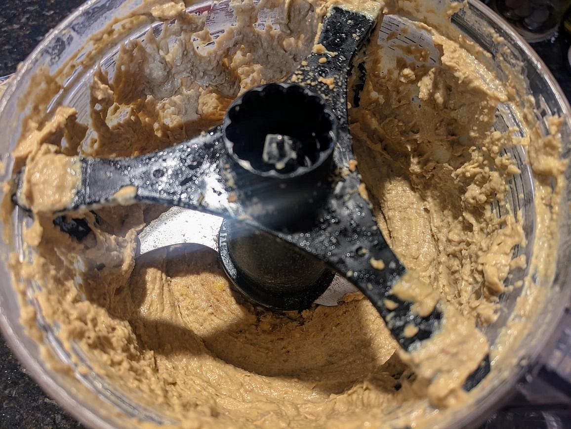Add the cooked lentils to the food processor with the remaining ingredients. Thin out with a small splash of water (if necessary), and blend until smooth.