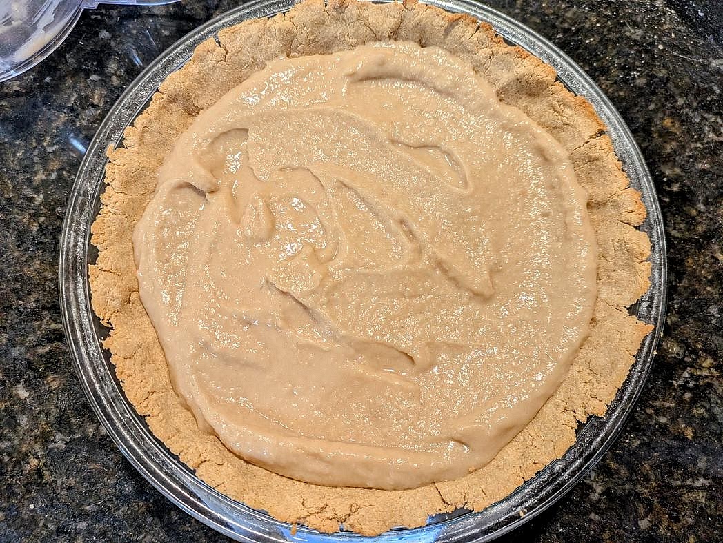 Pour your blended filling mixture into the baked pie crust.