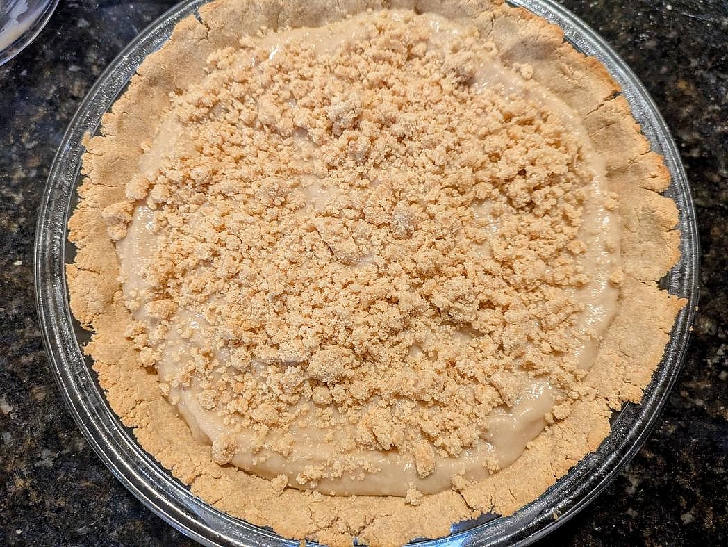 Crumble the remaining crust mixture on top of the filling.