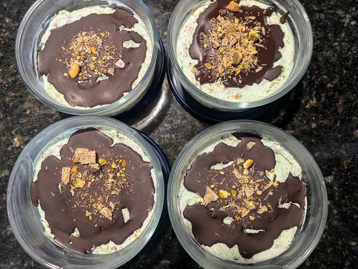 Pour your melted chocolate over the 4 yogurt bowls, about 15 g (~1 tbsp) in each. Top each bowl with your remaining mix-in mixture.
