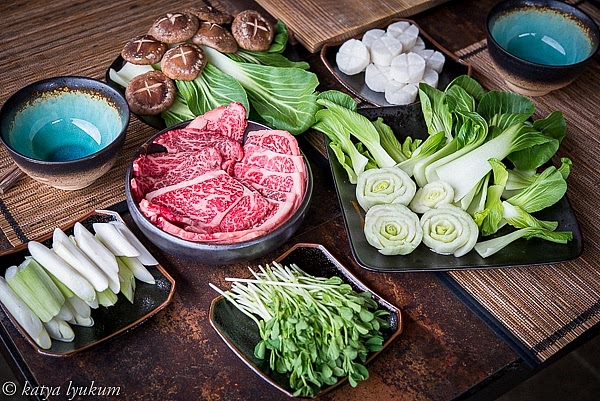 Wash, slice, and arrange sukiyaki ingredients on serving platters.