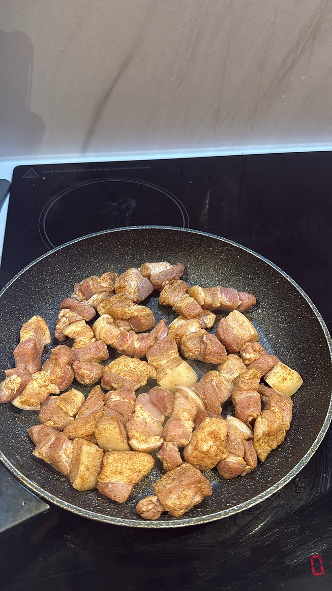 Add the pork to a dry frying pan in a single layer, then turn the heat to medium.