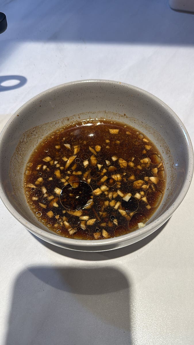 add the garlic, ginger , light soy sauce, dark soy sauce, brown sugar, rice vinegar, five spice and water and oil to a bowl