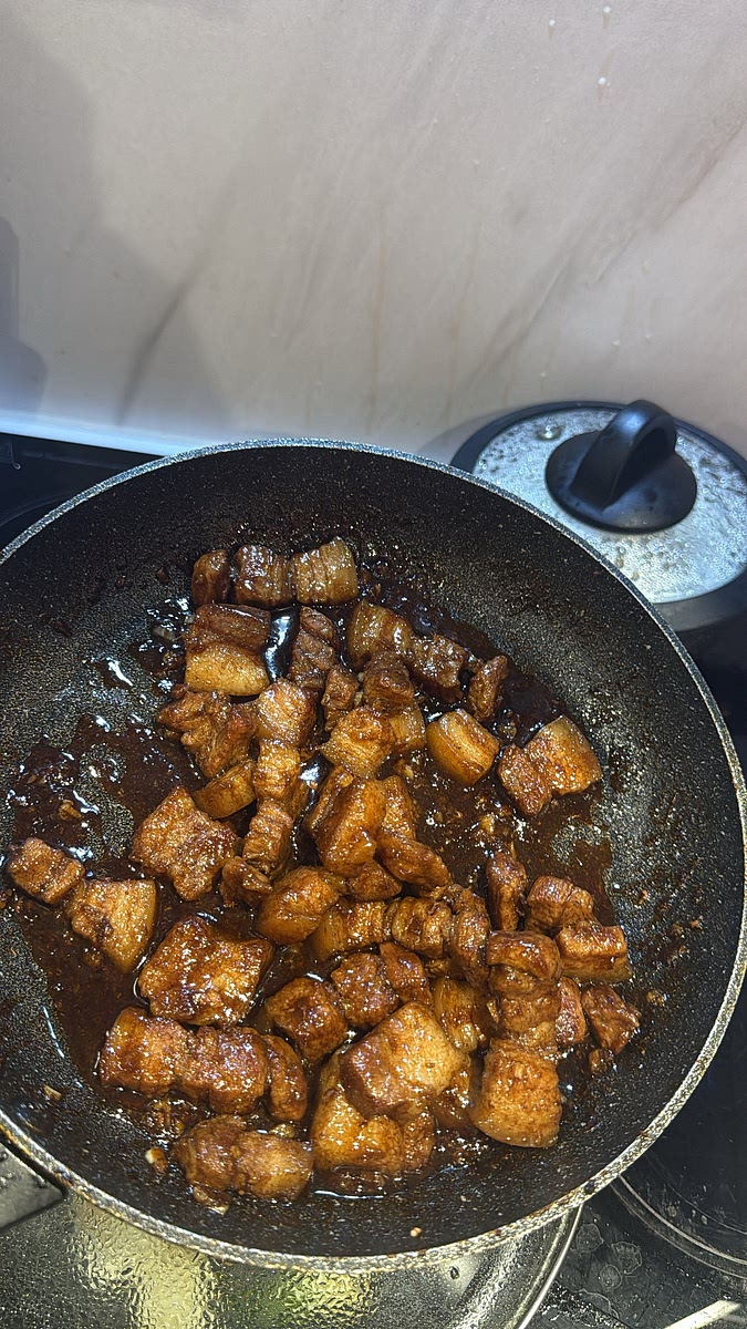 Cook uncovered for around 8–12 minutes, regularly tossing the pork through the sauce. Allow the sauce to reduce until dark, glossy and sticky, but leave a little extra sauce to coat the pork rather than reducing it completely dry. Turn off the heat
