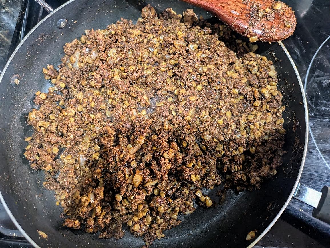 When the lentils are done cooking and the meat is no longer pink, add all your lentils and spice mix into the meat. Mix together, and cook for an additional 2 minutes, or until you can smell the spices. Season with salt or lime juice to taste, and serve.